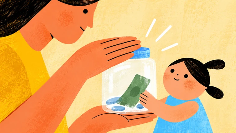 A mother places her child's money in a savings jar as the child watches on.