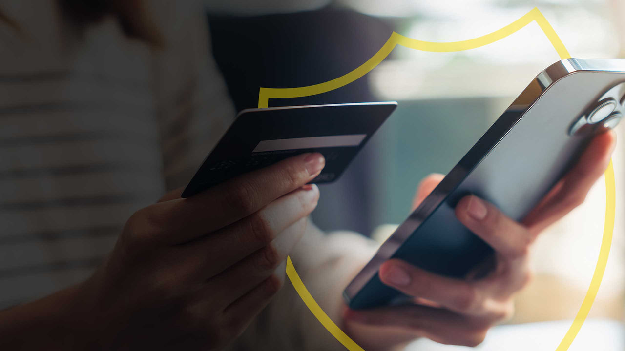 A shopper uses their phone to make a purchase after inputting their card information.
