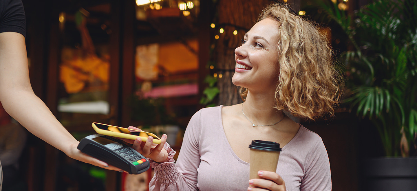 woman-paying-for-coffee-with-phone