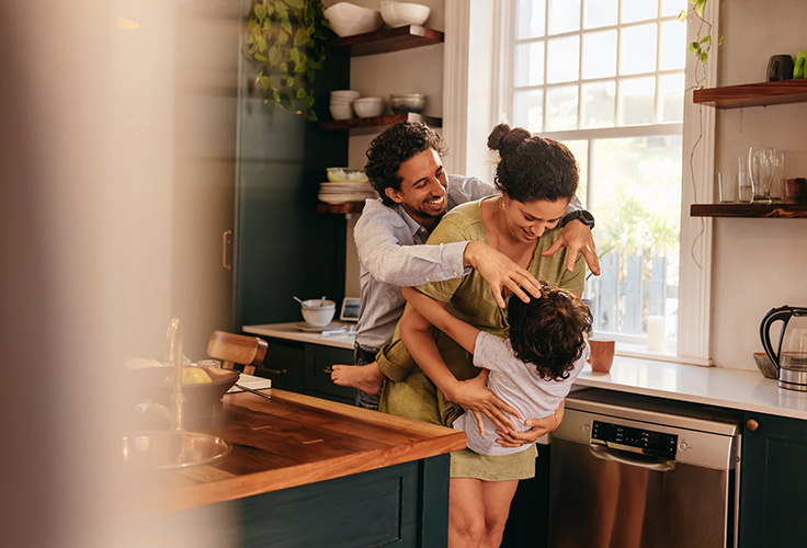 family-hugging-in-kitchen